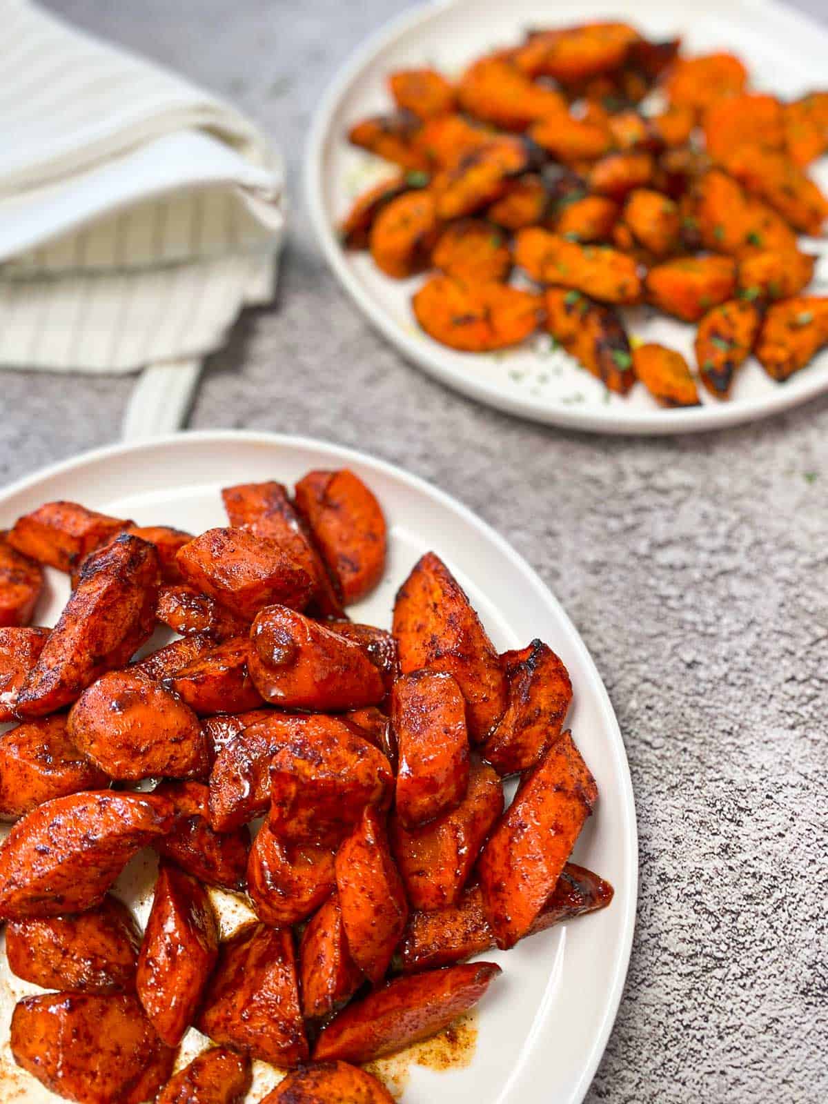 sweet glazed carrots in white serving dish