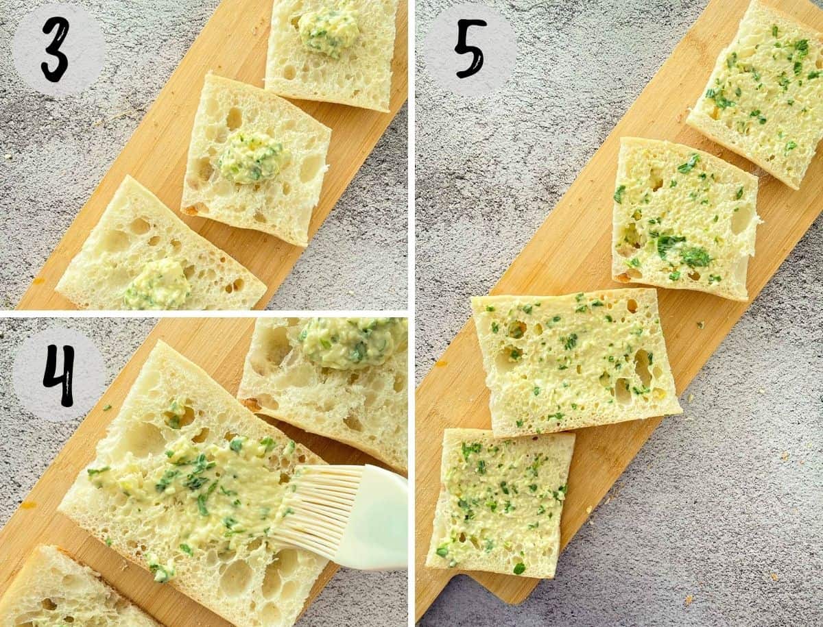 Slices of bread with garlic butter being spread on top.