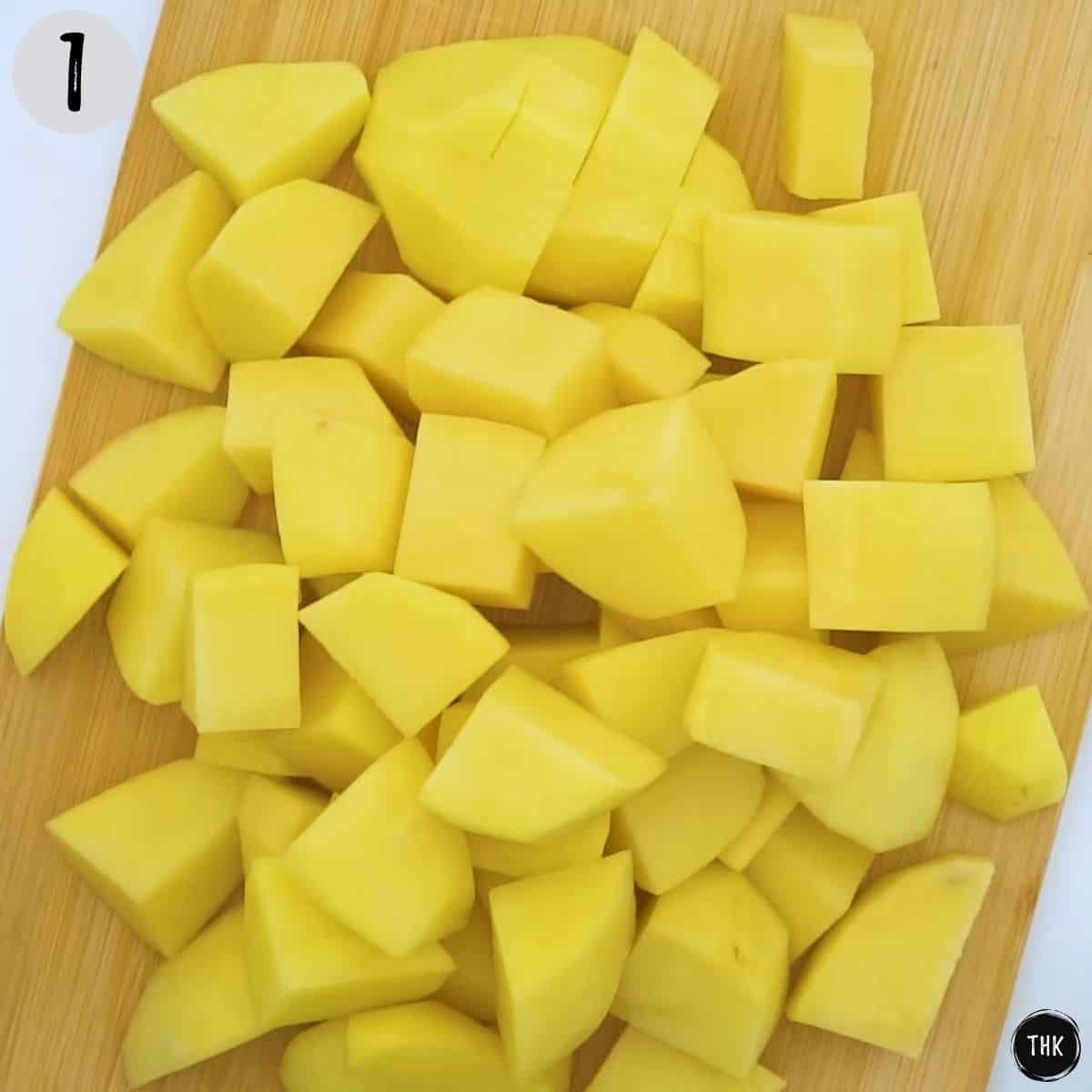 Chopped potatoes on cutting board.