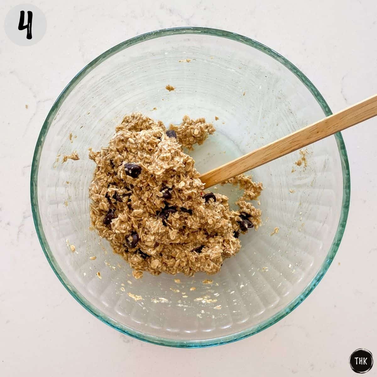Cookie dough mixture inside large glass bowl.