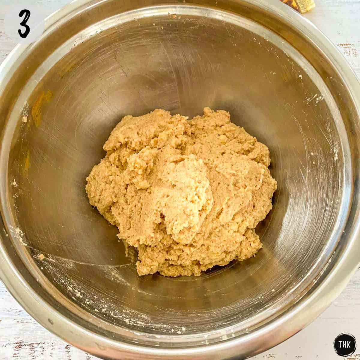 Muffin batter inside large mixing bowl.