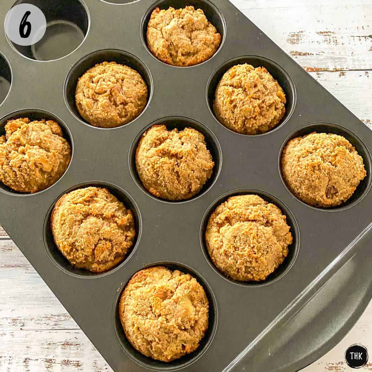 Baked banana muffins inside muffin tin.