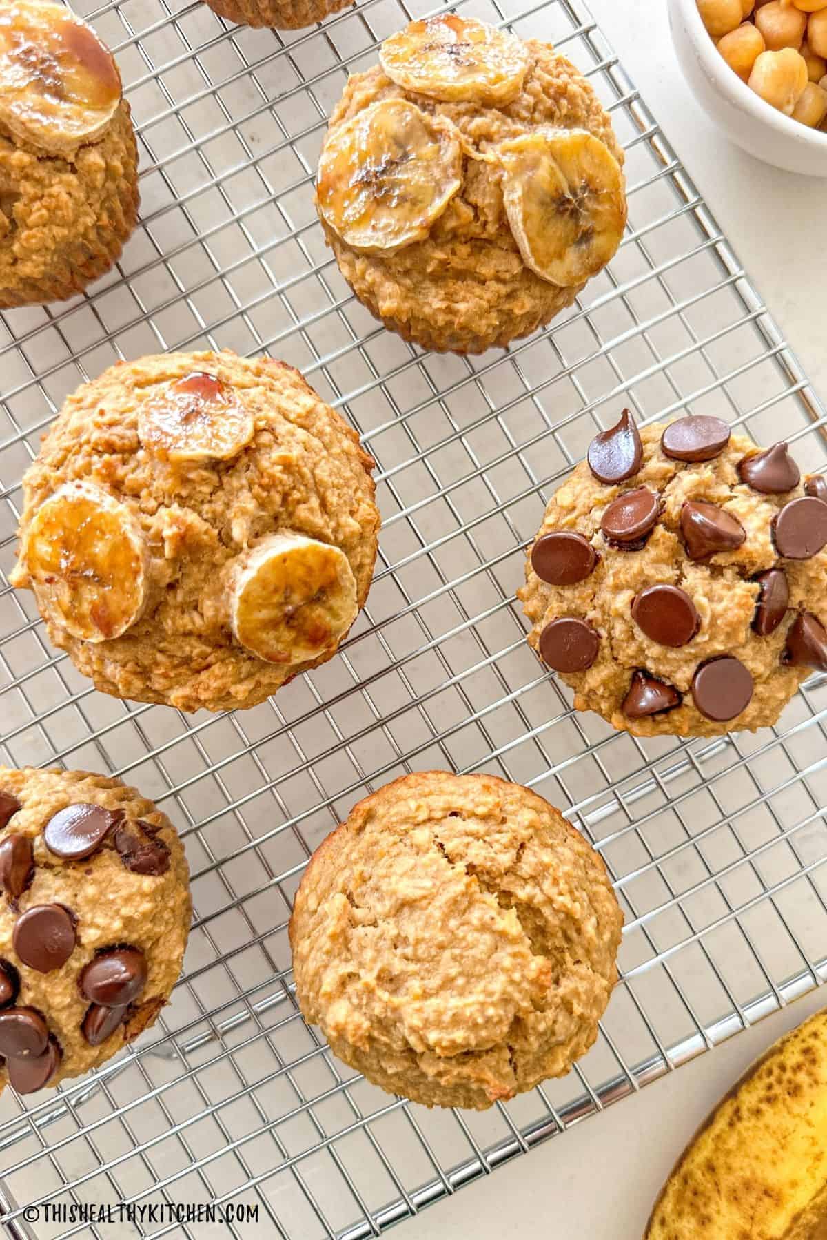 Banana muffins with chickpeas on wire rack.