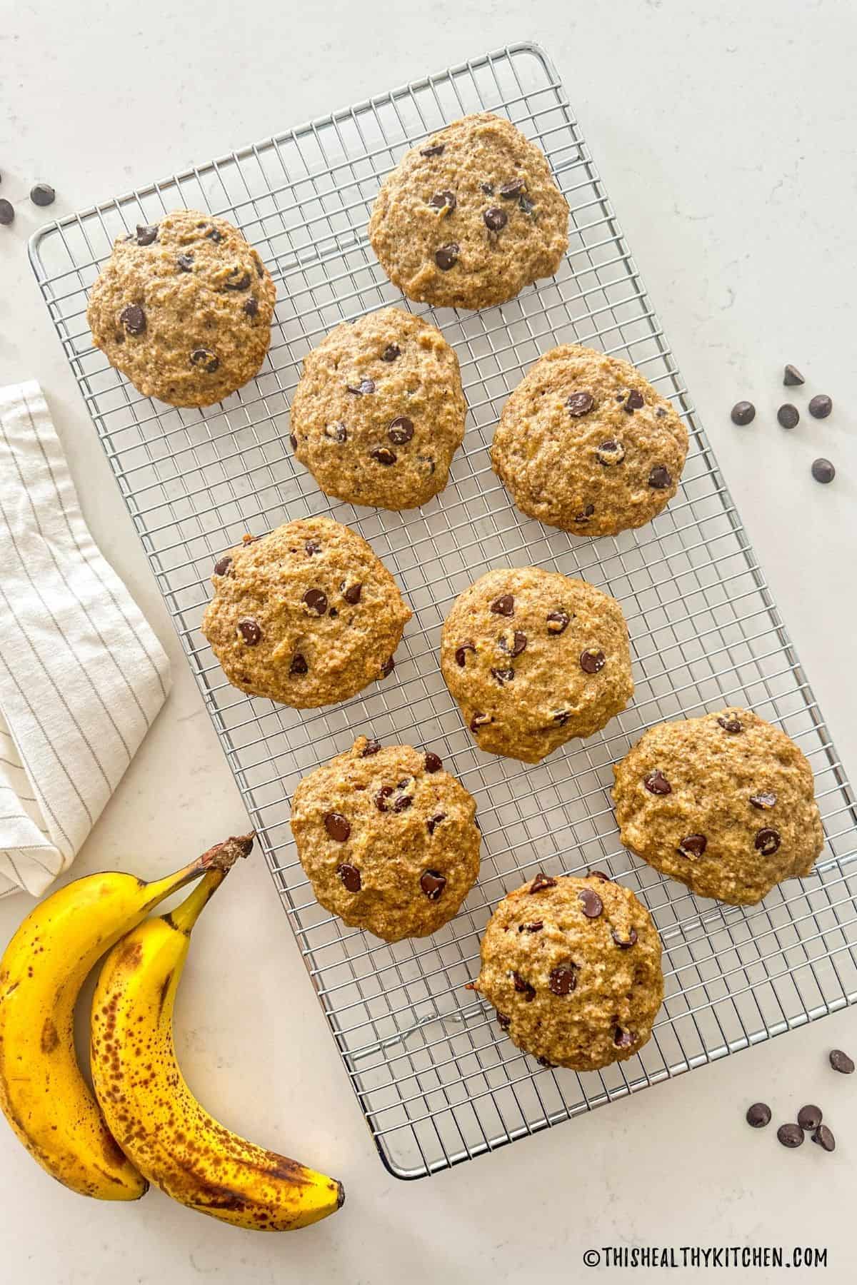 Banana chocolate chip cookies on wire rack.