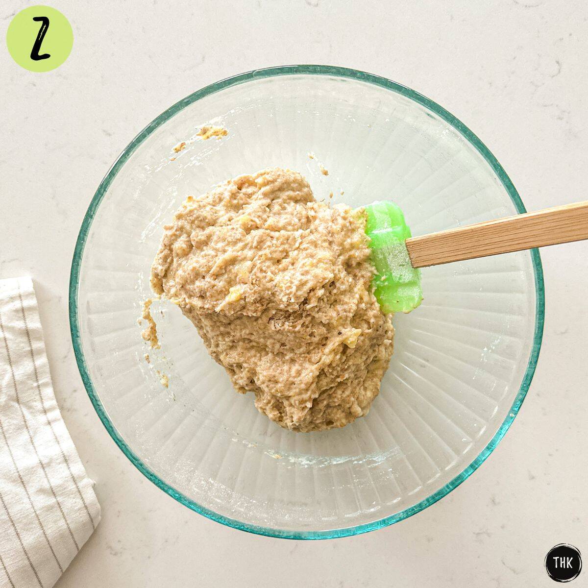 Cookie dough batter inside large mixing bowl.