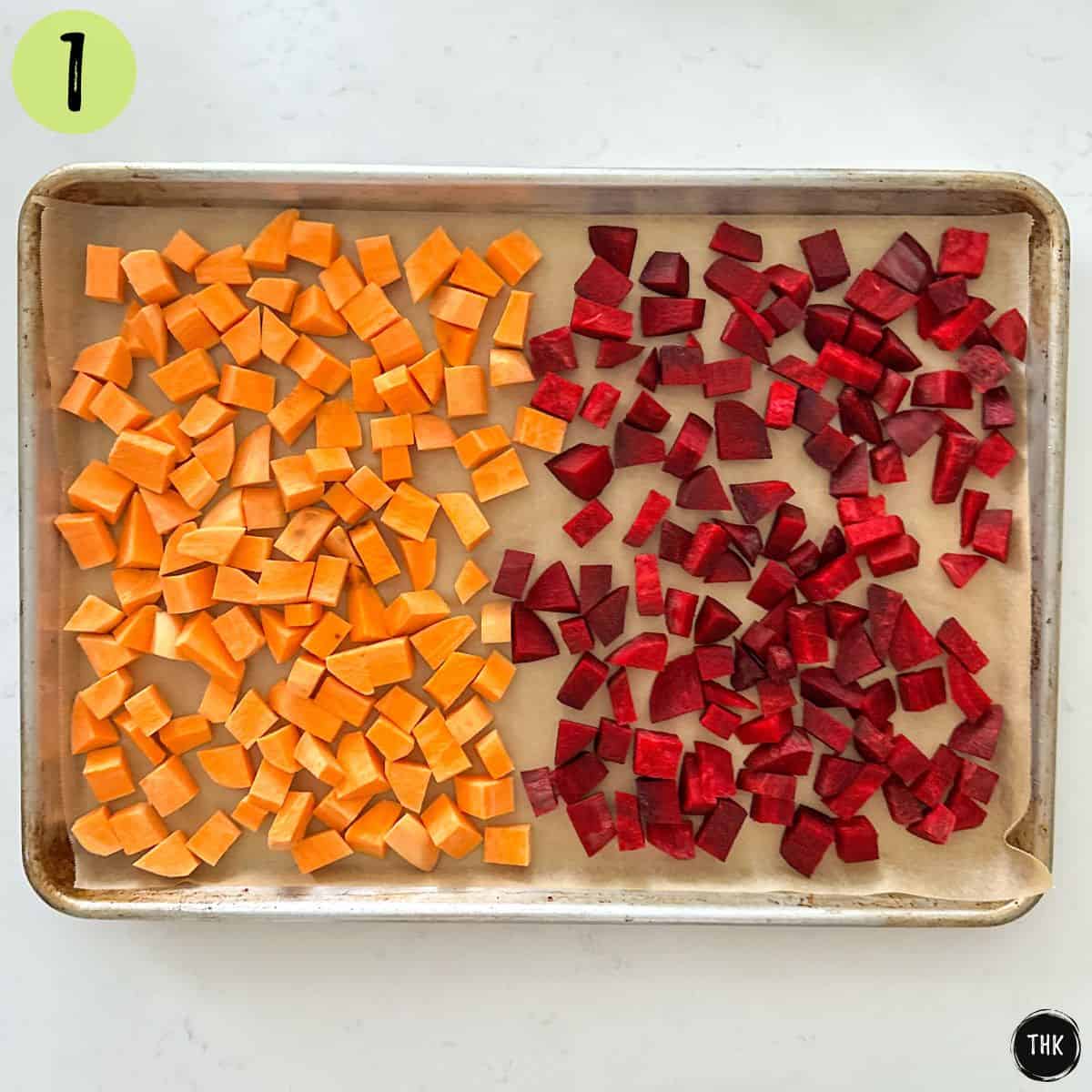 Baking pan with cubed sweet potatoes and beets.