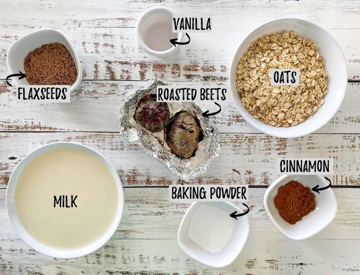 Ingredients to make beet pancakes on white and brown deck.