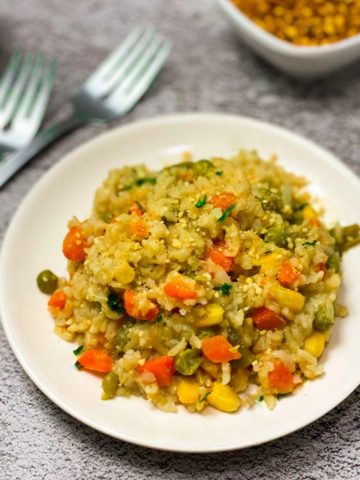 Instant Pot brown rice risotto in white plate.
