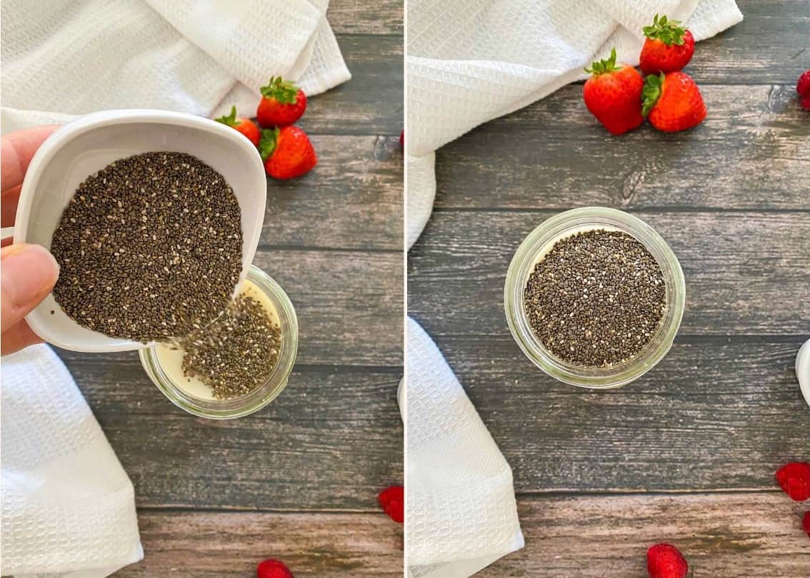 Hand pouring chia seeds into glass jar filled with milk.