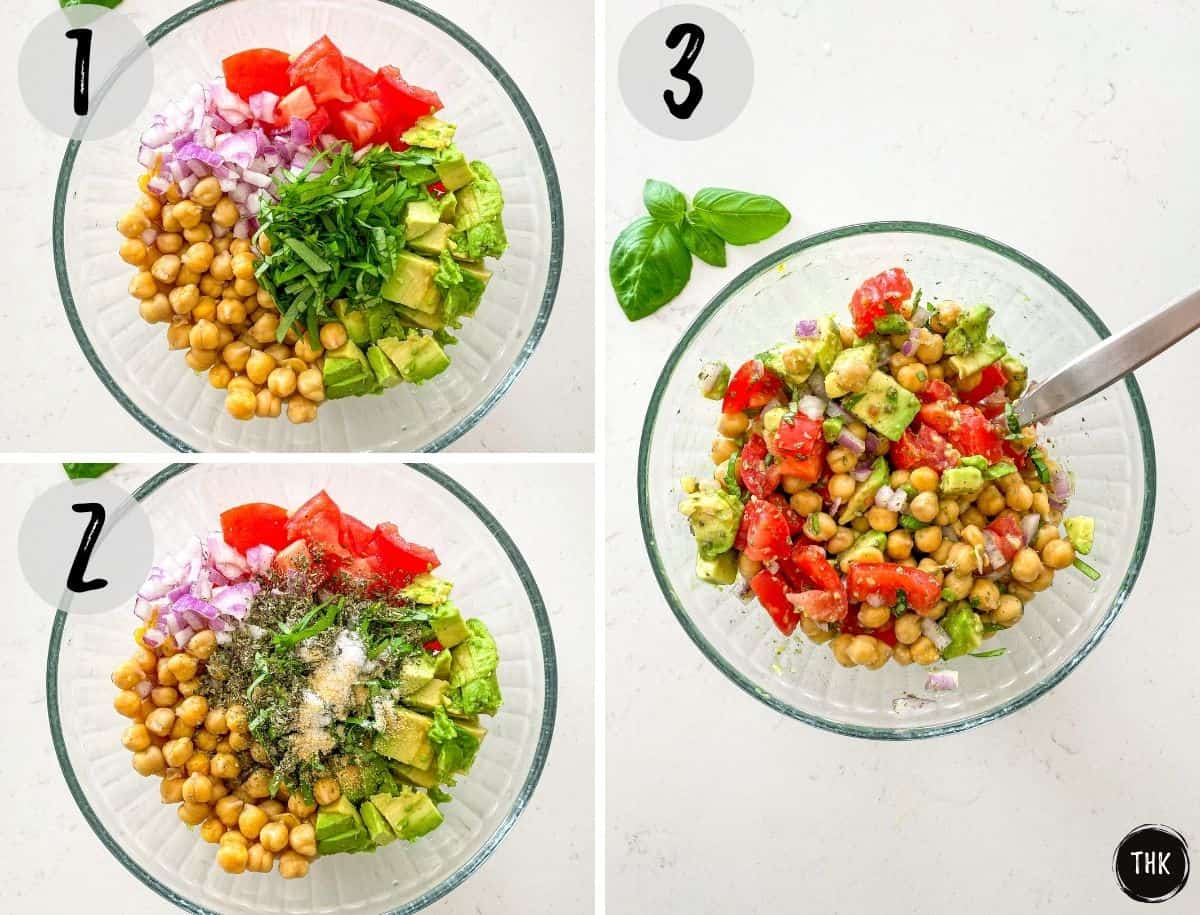 Glass bowl with salad ingredients being stirred and combined.