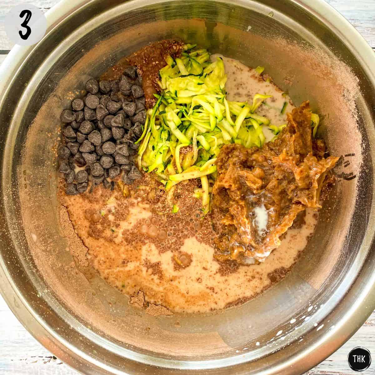 Zucchini shreds, chocolate chips, date paste, milk, flour and cocoa in large mixing bowl.