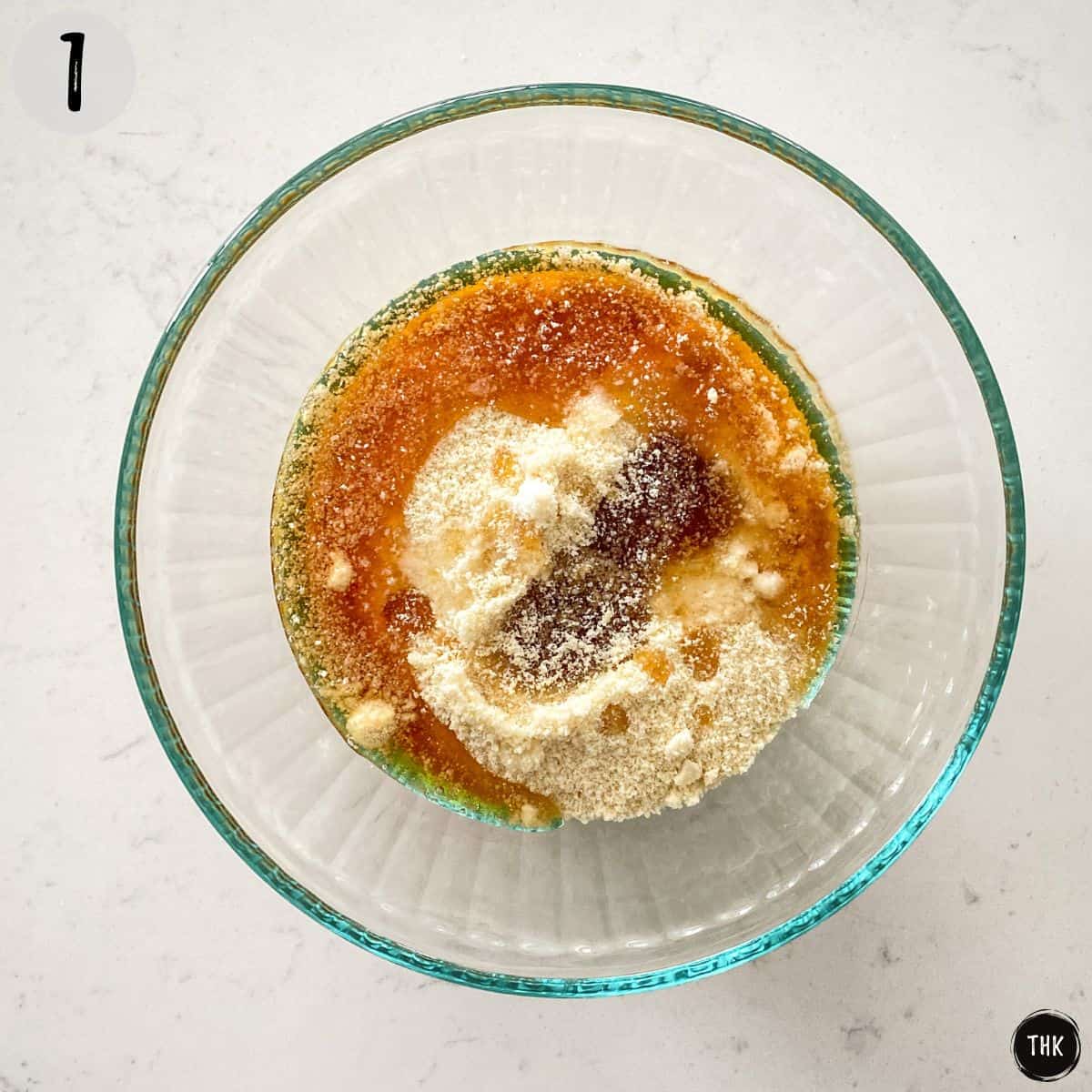 Mixing bowl with flour, syrup and spices inside.