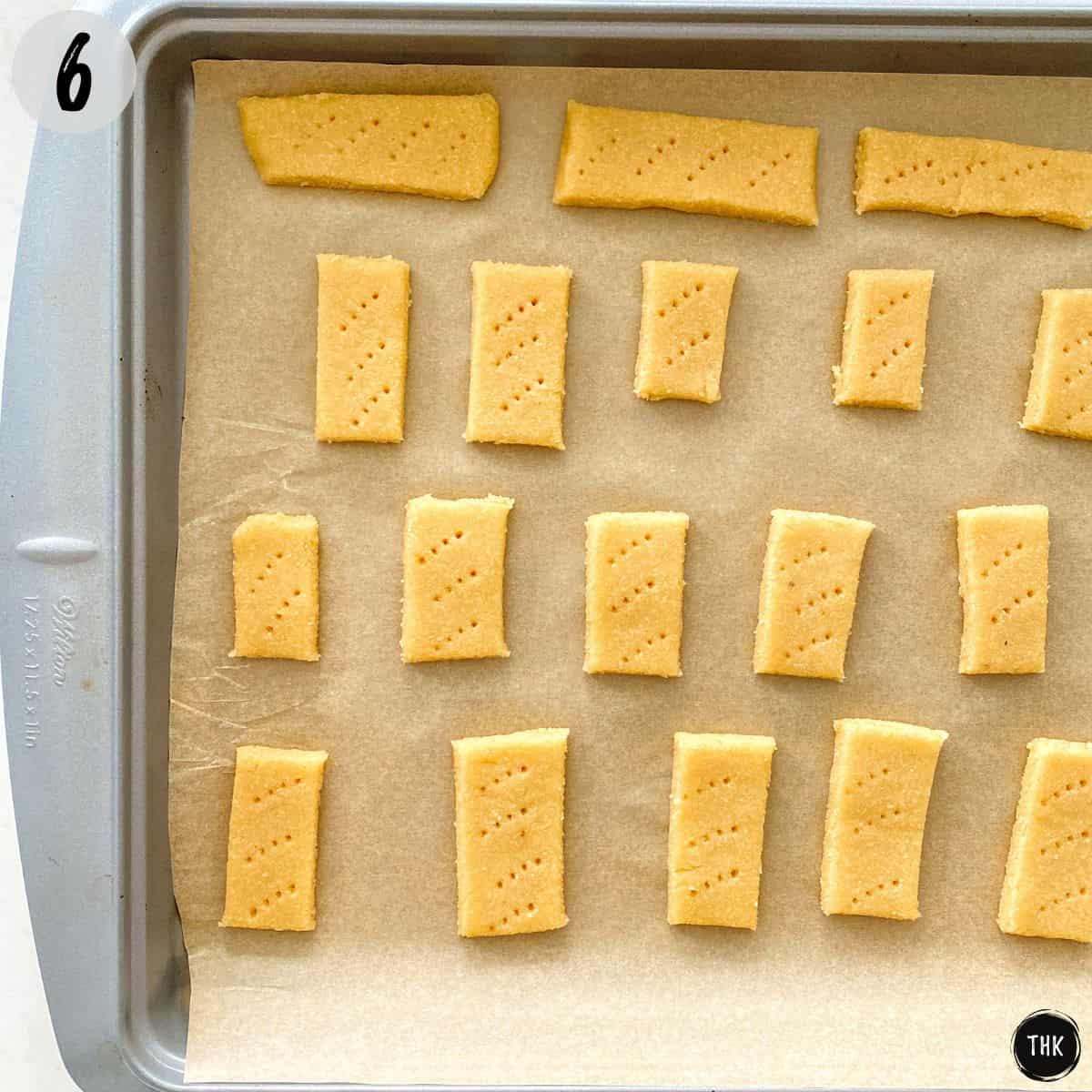 Unbaked vegan shortbread cookies on baking sheet.