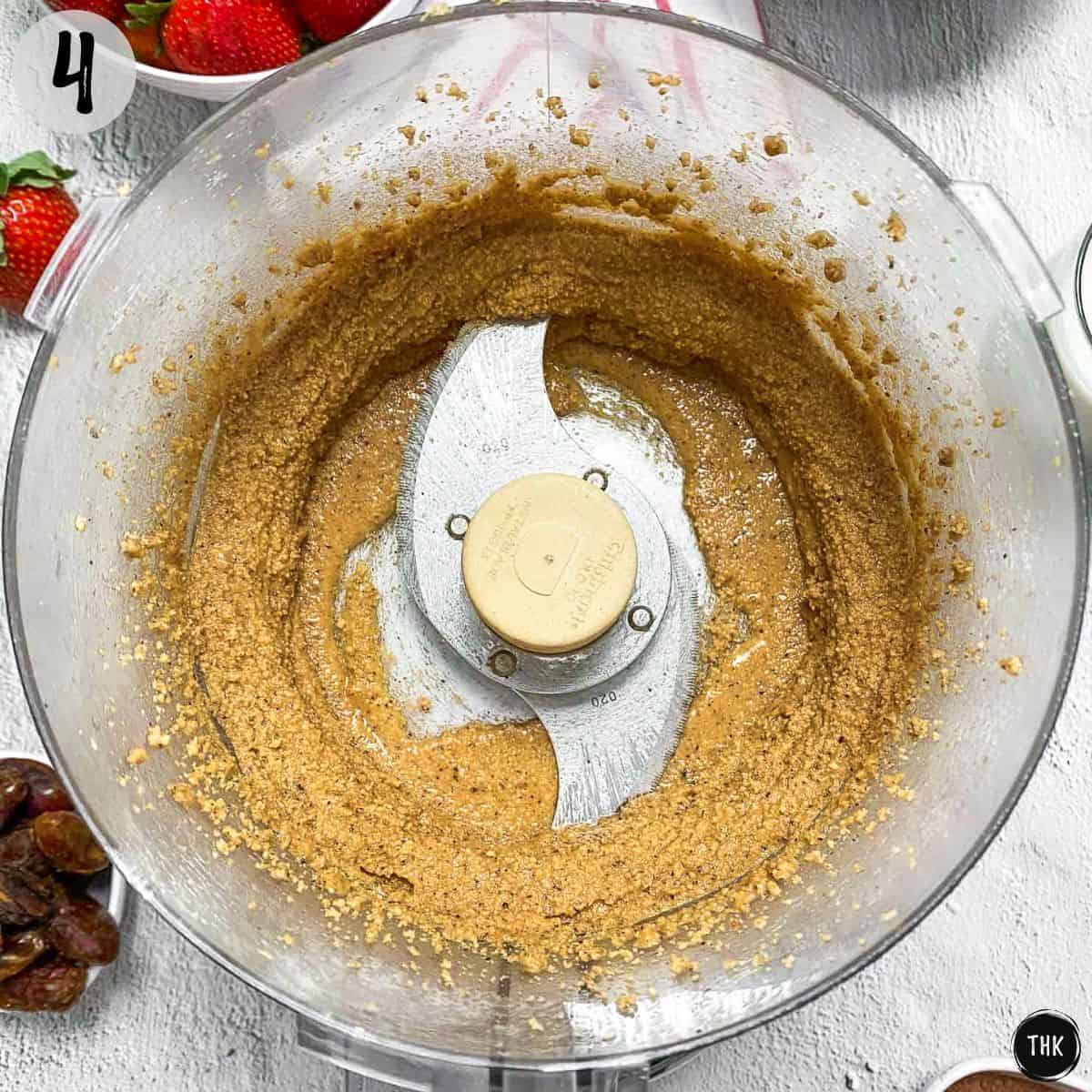 Hazelnut spread inside food processor bowl.