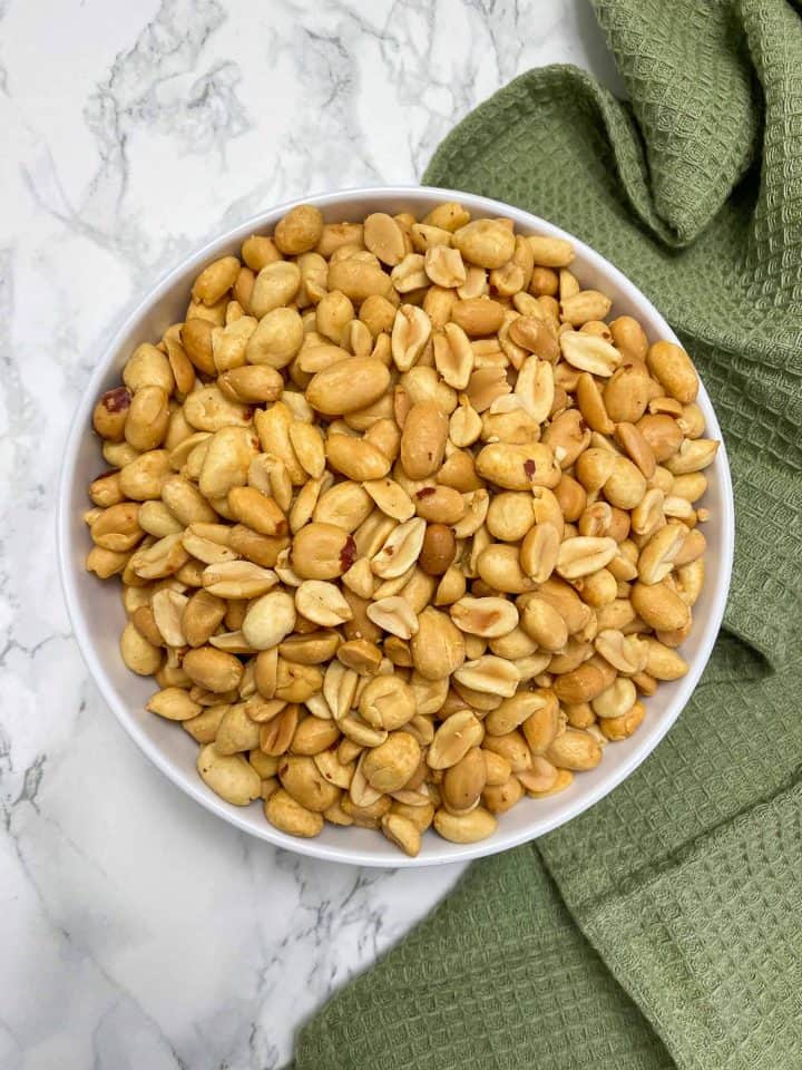 white bowl filled with roasted peanuts