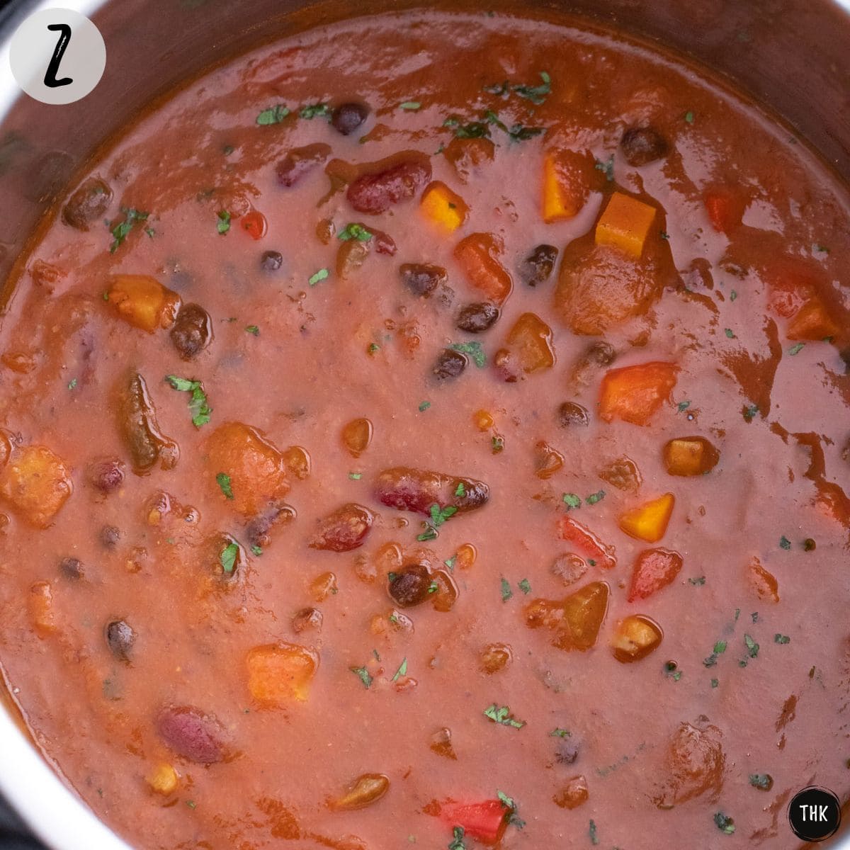 Instant Pot filled with tomato bean soup with veggies.