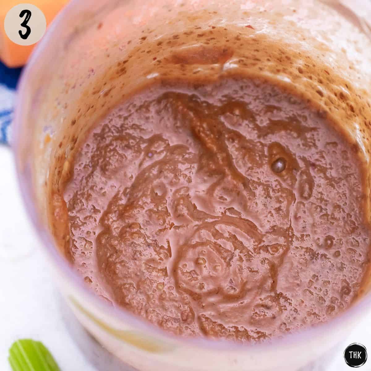 Bean puree inside small blender.