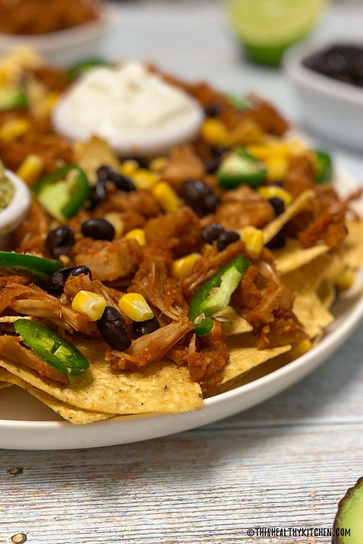 BBQ jackfruit over a platter of tortilla chips