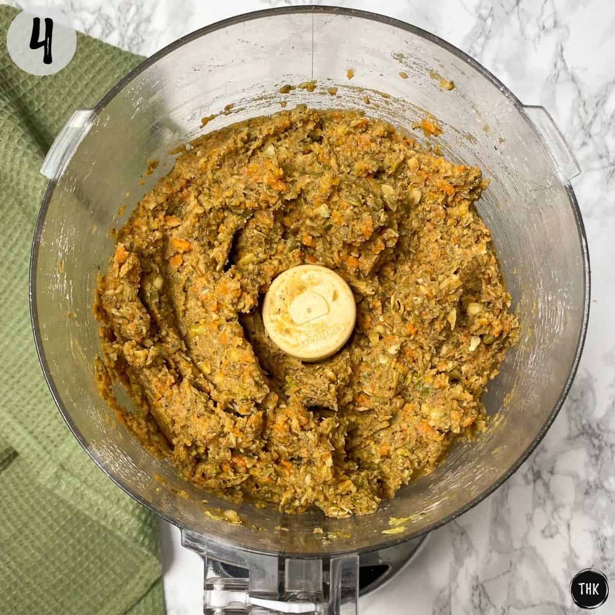 Vegan meatball mixture inside food processor.