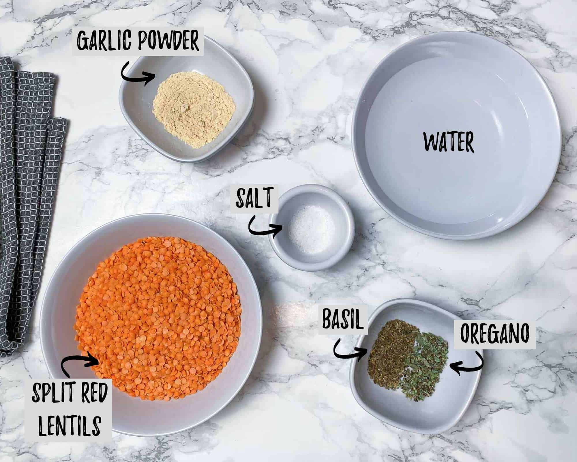 ingredients needed to make lentil pizza crust on marble counter