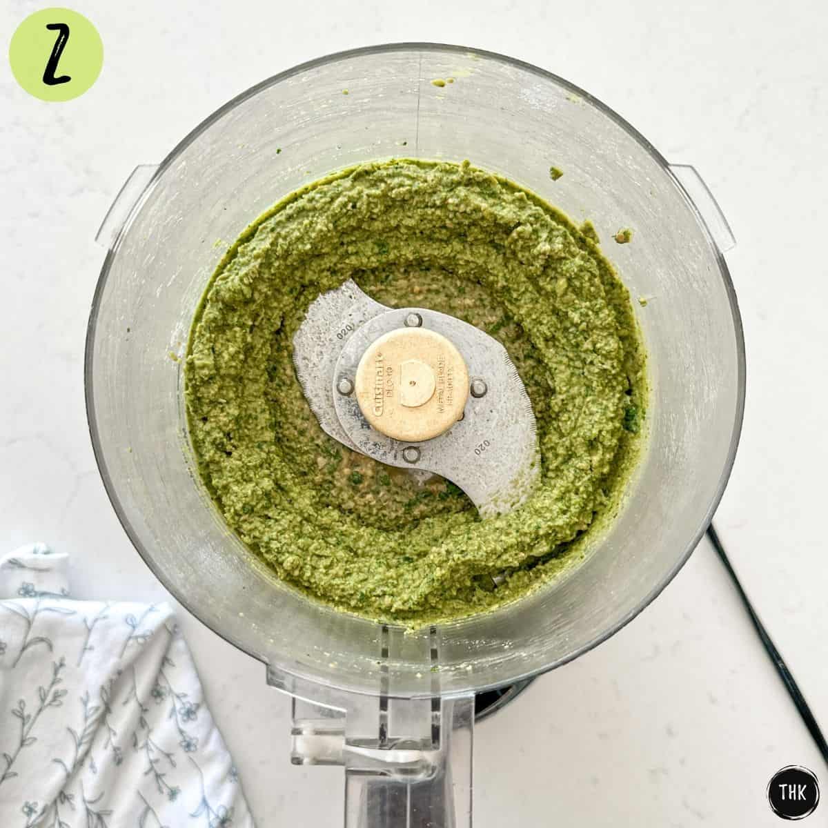 Processed miso pesto inside bowl of food processor.
