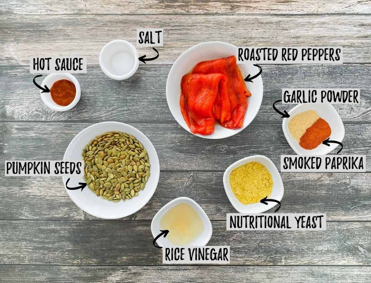 Ingredients needed to make nut free vegan cheese sauce in bowls on  deck.