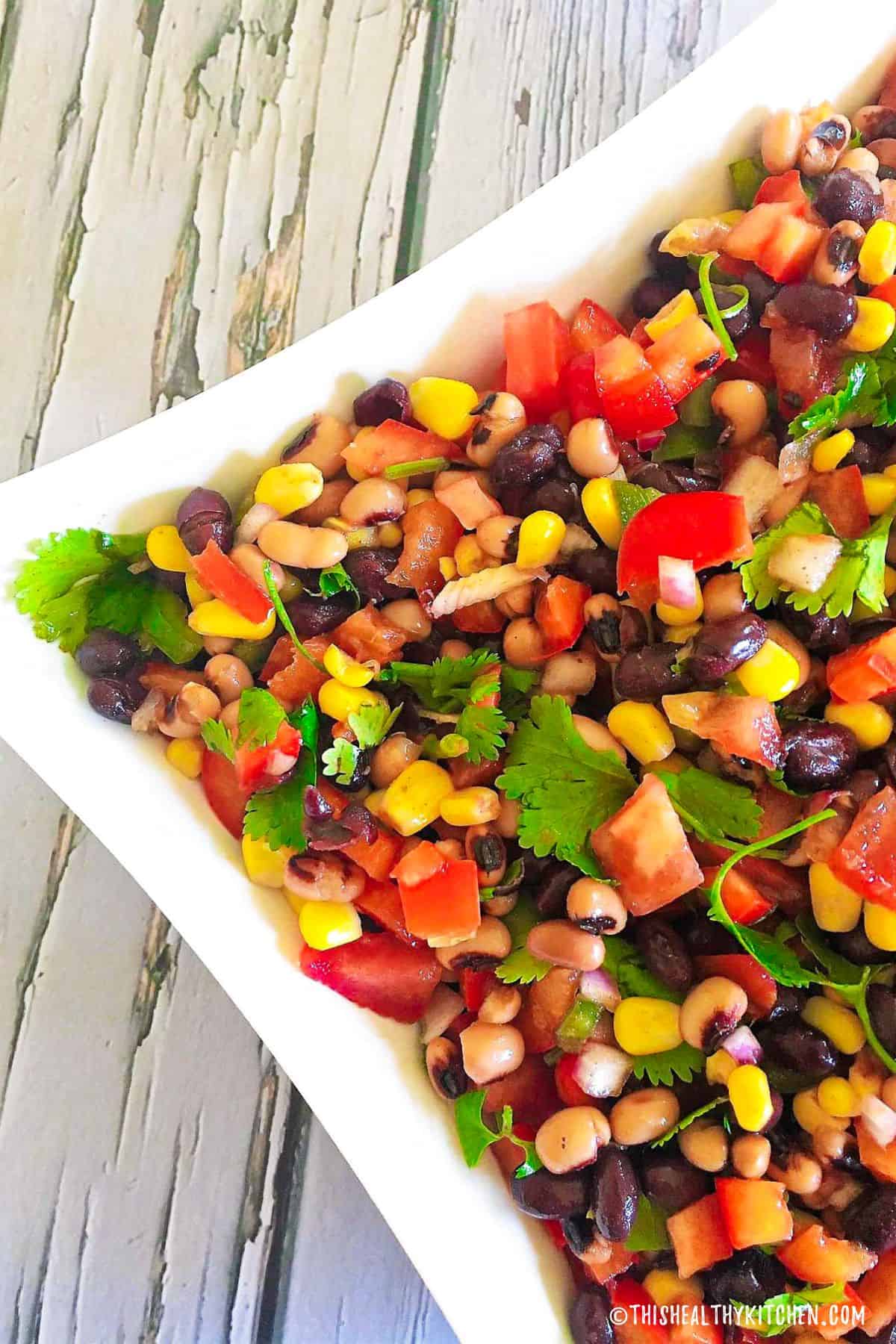 Cowboy caviar in square white dish.