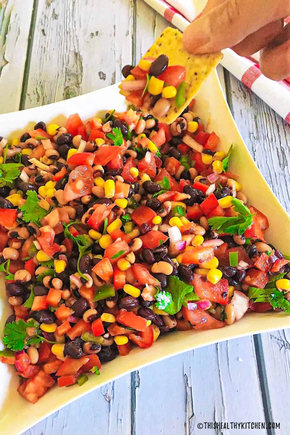 Chip scooping up cowboy caviar.