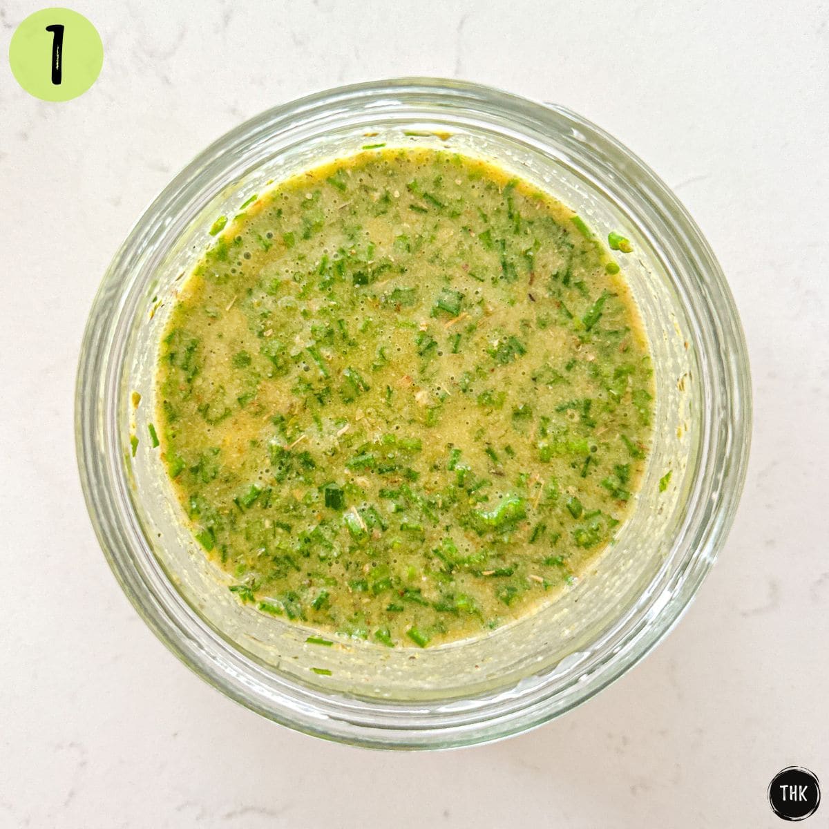 Lemon Dijon dressing in small glass jar.
