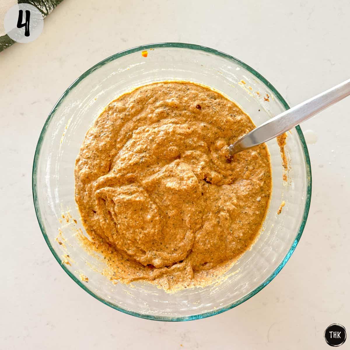 Muffin batter inside large mixing bowl.
