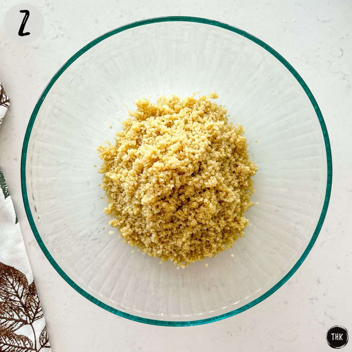 Cooked quinoa inside large mixing bowl.