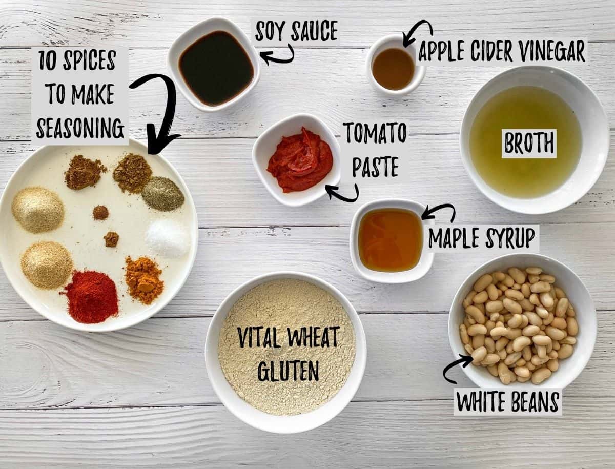 Ingredients to make vegan hot dogs in bowls on white deck.