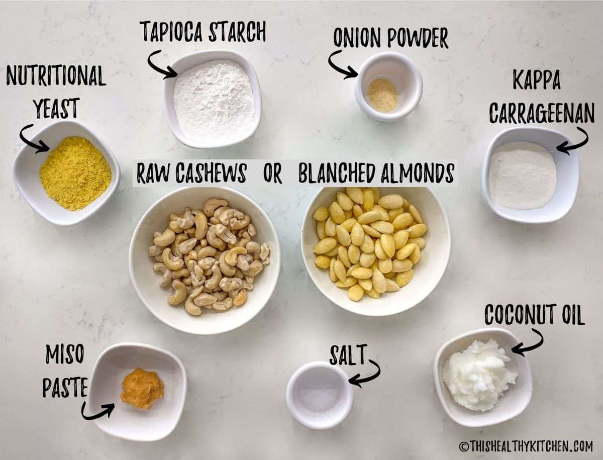Ingredients scattered on kitchen counter top to make vegan cheese.