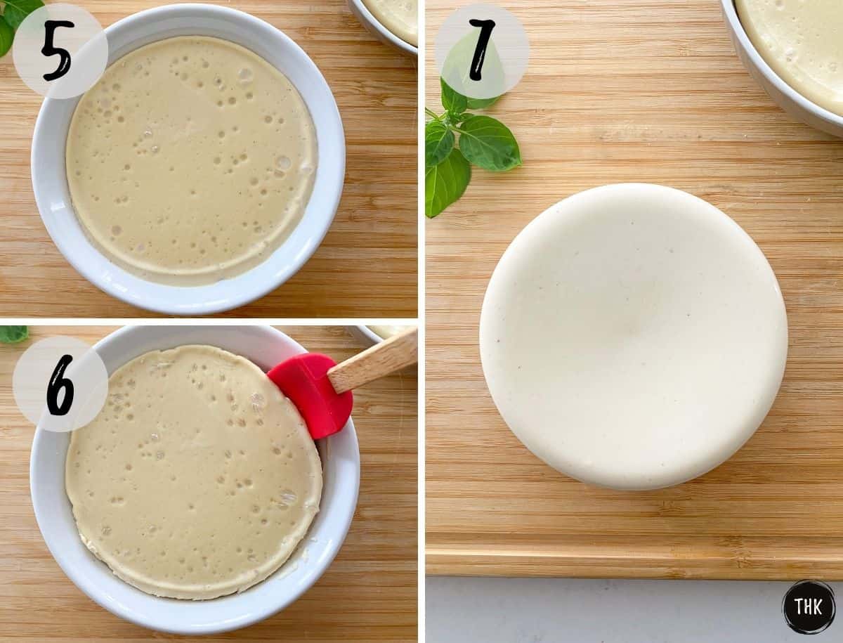 Vegan cheese being scooped out of white dish and placed on wooden cutting board.