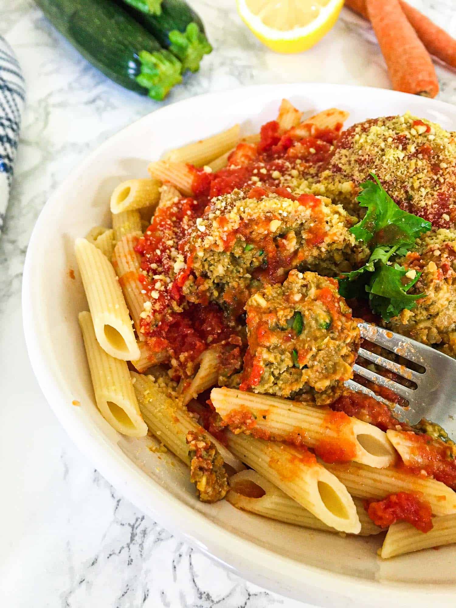 fork holding up a bite of meatball