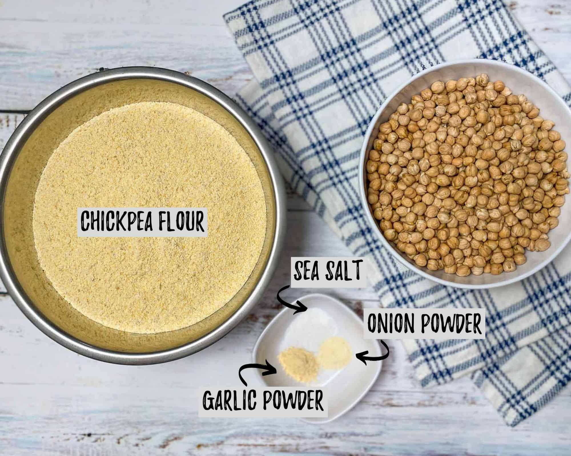 bowl of flour and bowl of chickpeas with blue and white towel underneath