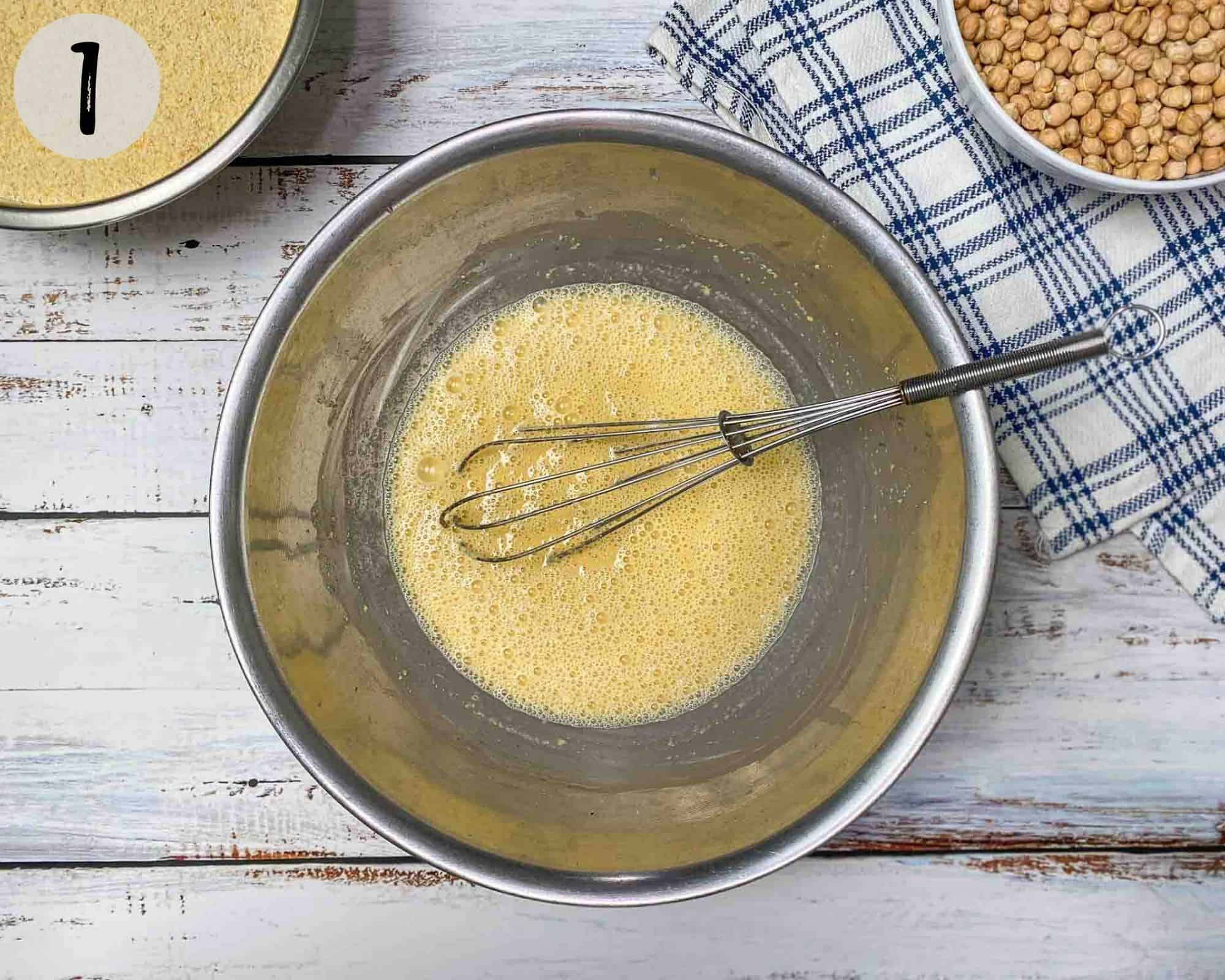 batter in mixing bowl with whisk inside