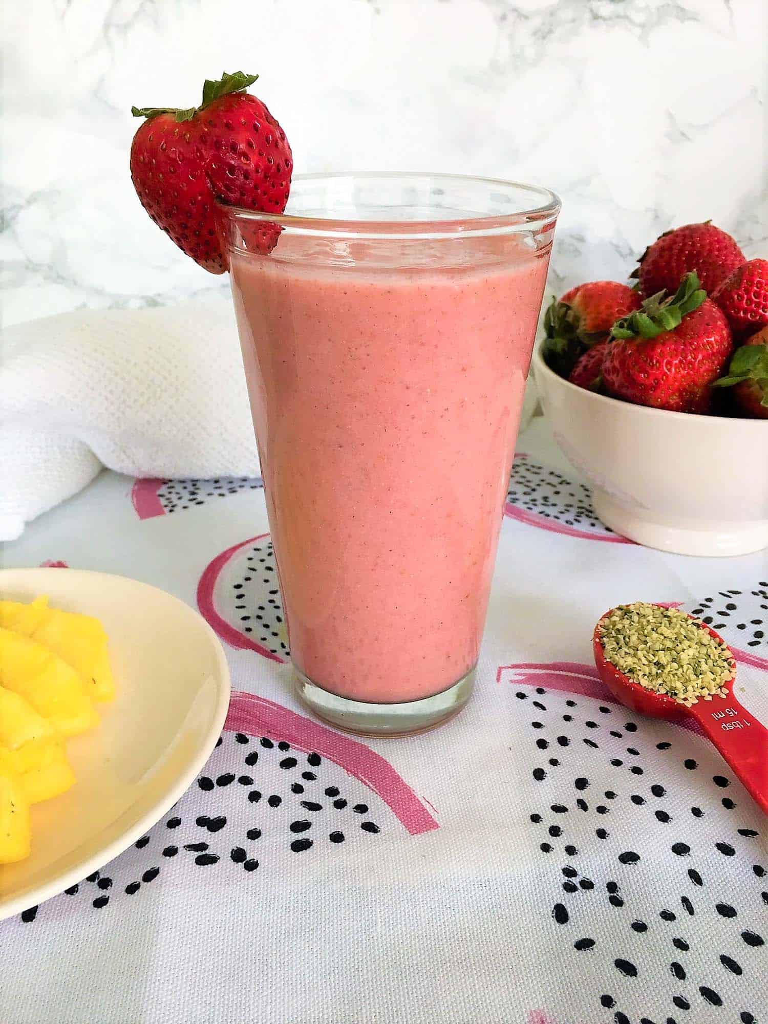 strawberry smoothie with strawberry garnish