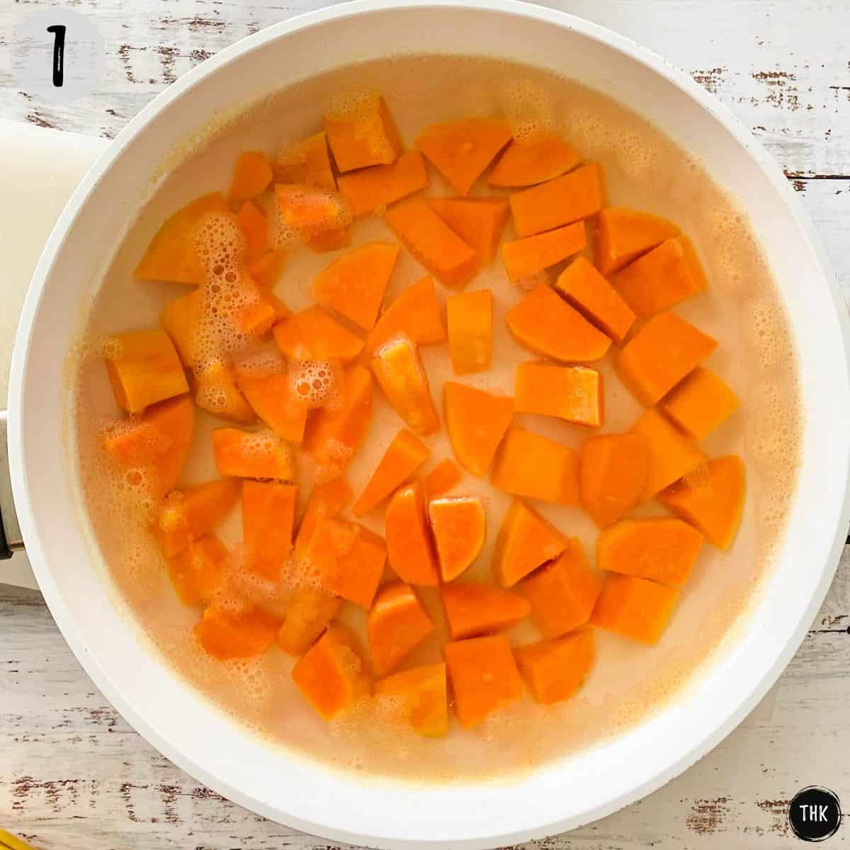 Cubed sweet potato in pan, covered with water.