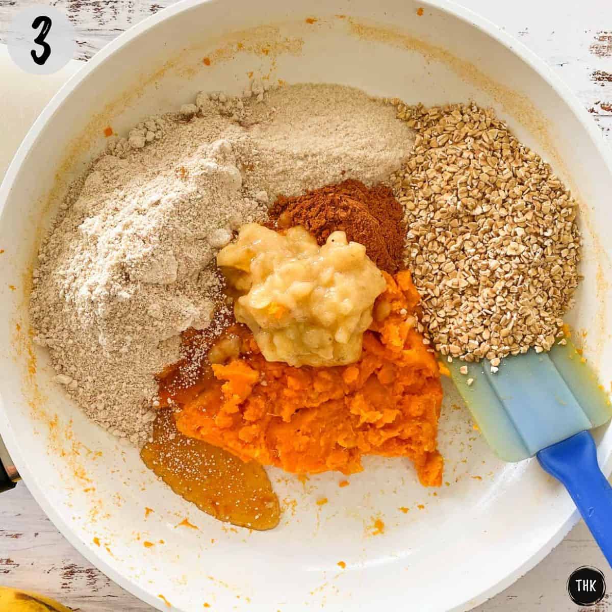 Oats, flour, mashed banana, maple syrup and cinnamon inside pan.