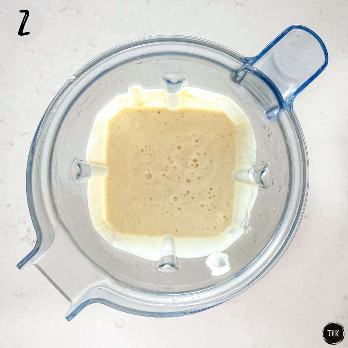Creamy white tofu pasta sauce inside blender.