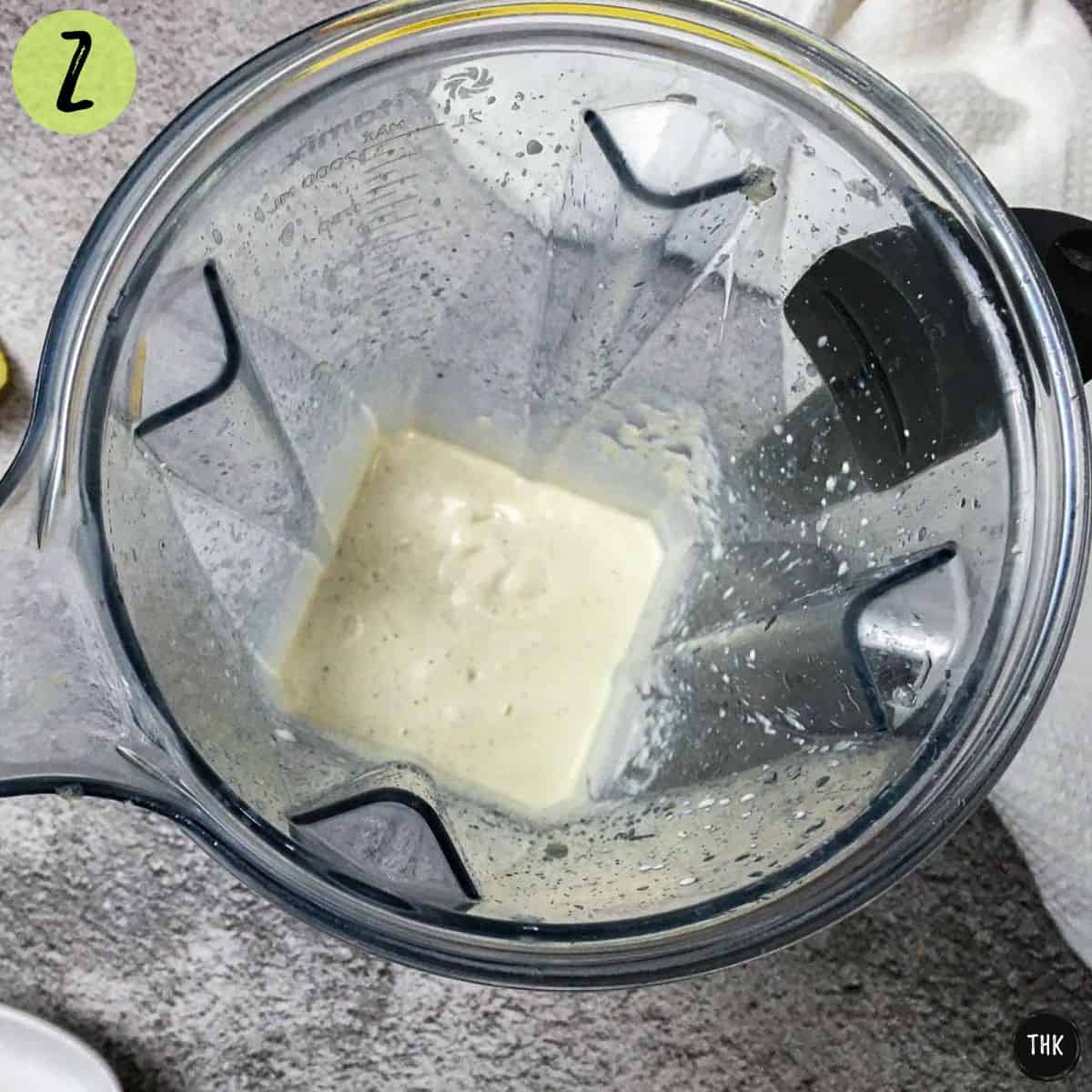 White creamy sauce inside blender.