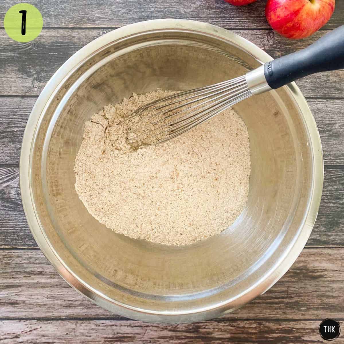 Flour and other dry ingredients whisked inside a large mixing bowl.