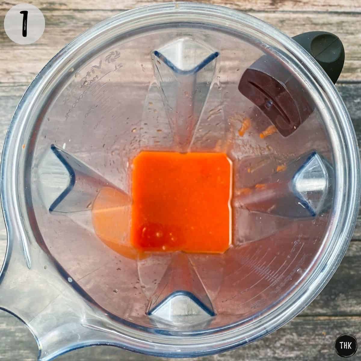 Red mixture inside blender.