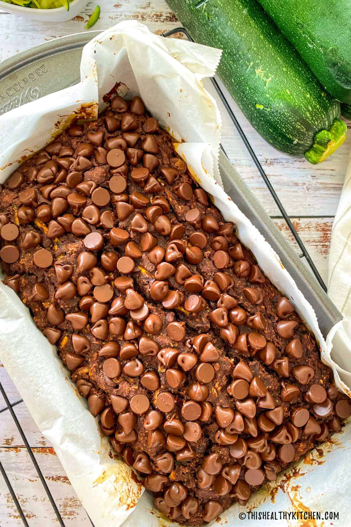 Baked chocolate zucchini bread inside loaf pan.
