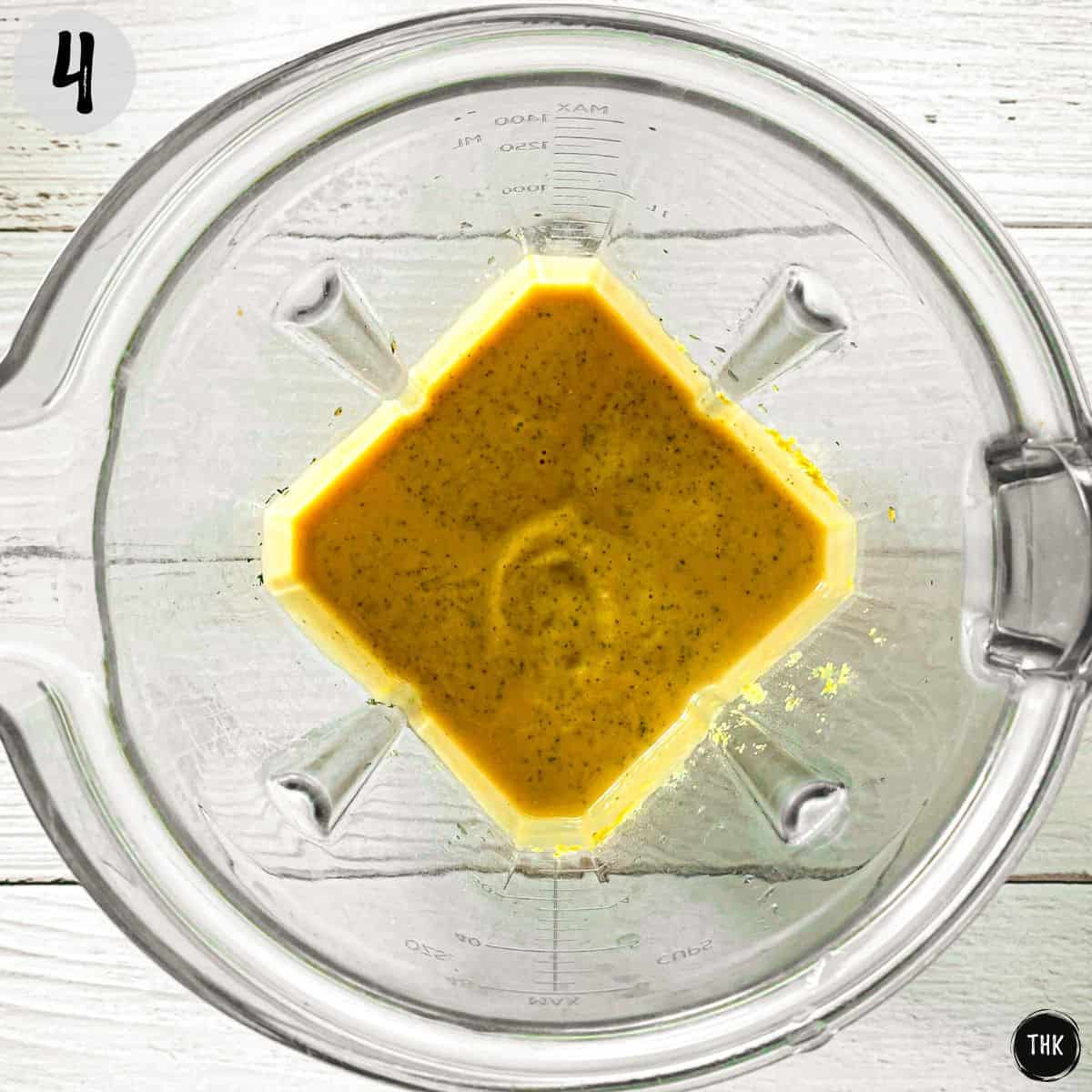 Vegan cheesy salad dressing inside blender.