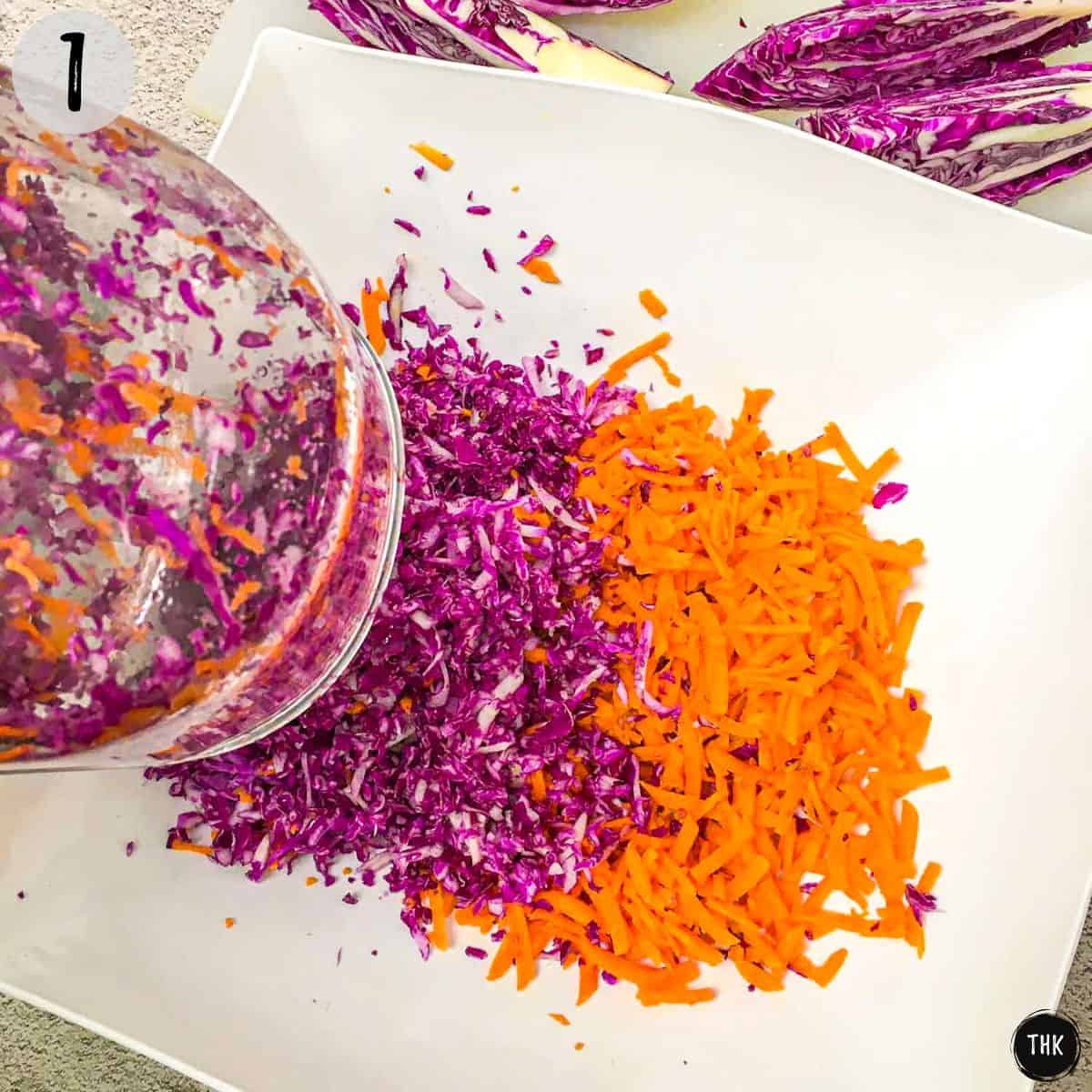 Shredded cabbage and carrots inside bowl.
