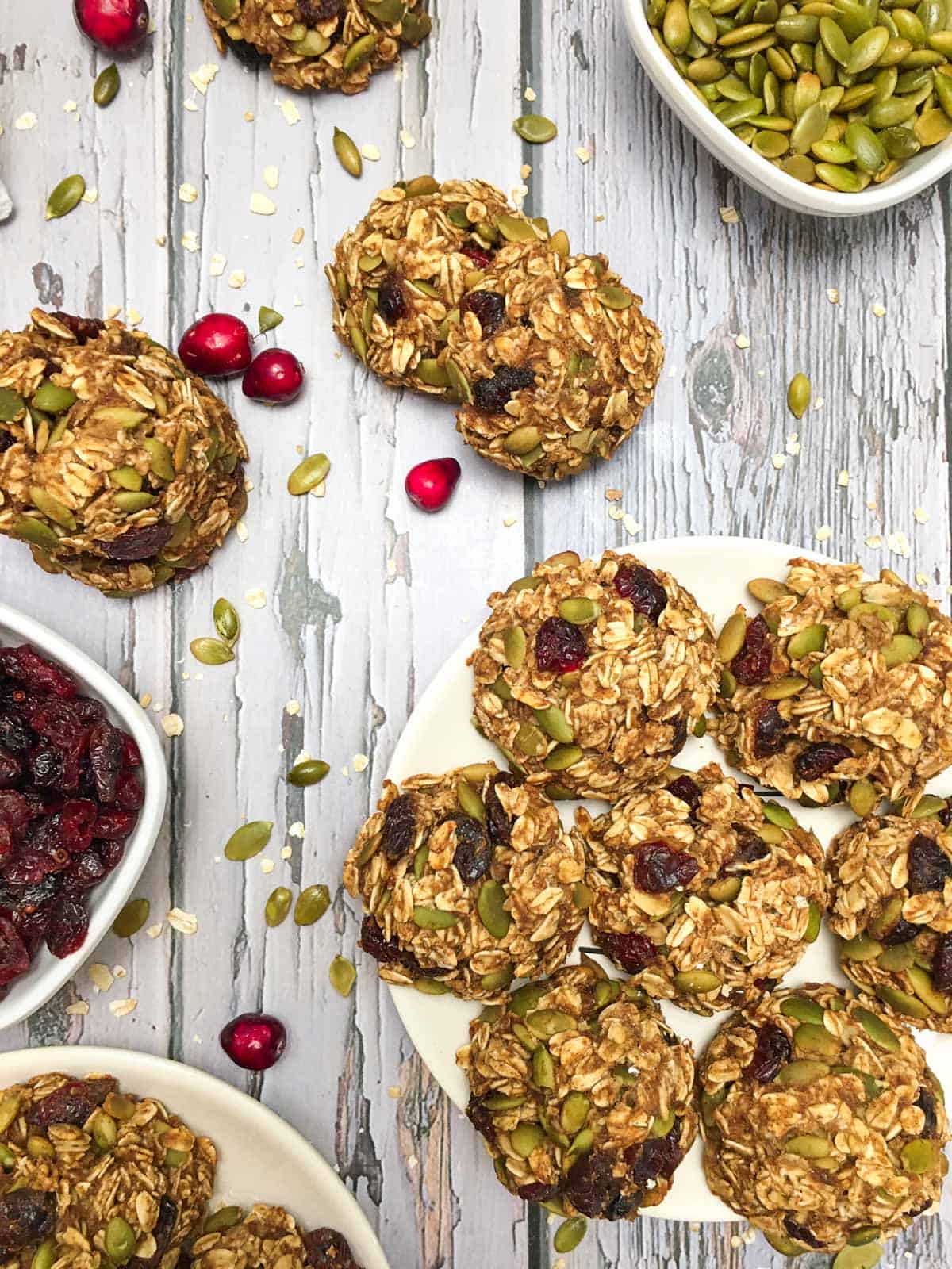 Plate of oatmeal cranberry cookies on grey deck.