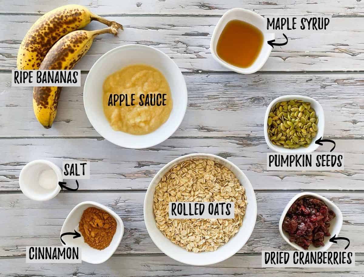 Ingredients to make vegan cranberry oatmeal cookies on grey deck.