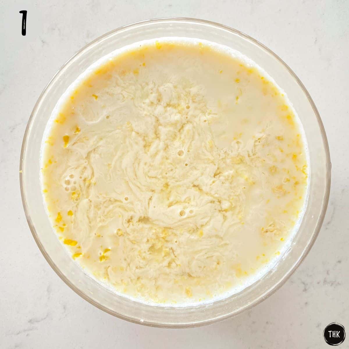 Milk and lemon juice and zest in bowl.